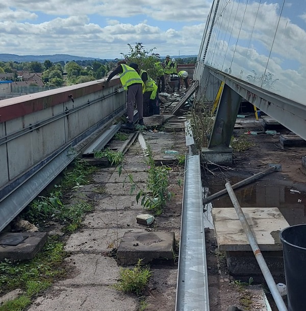 workers outside performing some groundwork on a commercial building